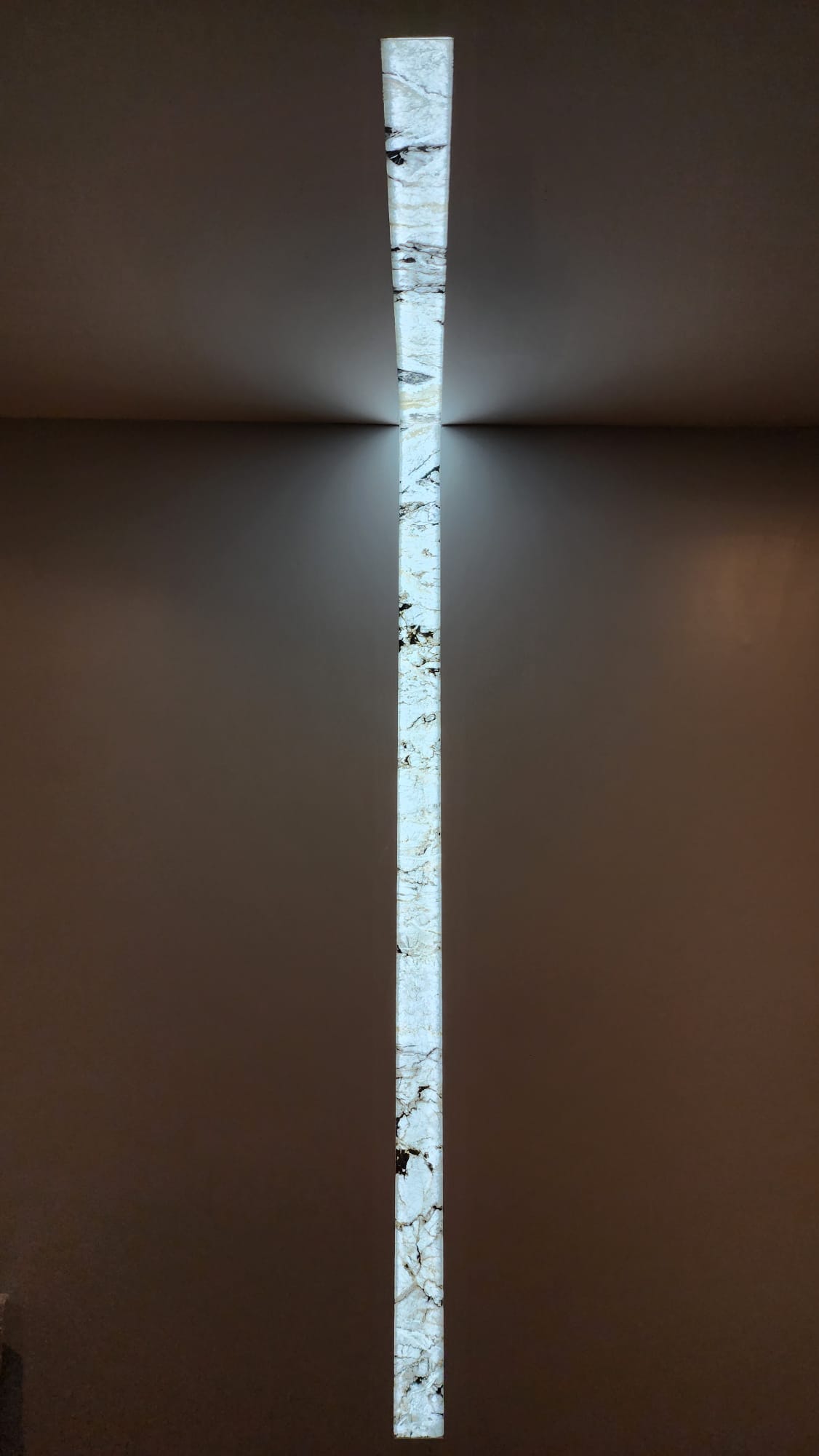 Backlit ultra-thin stone column installation